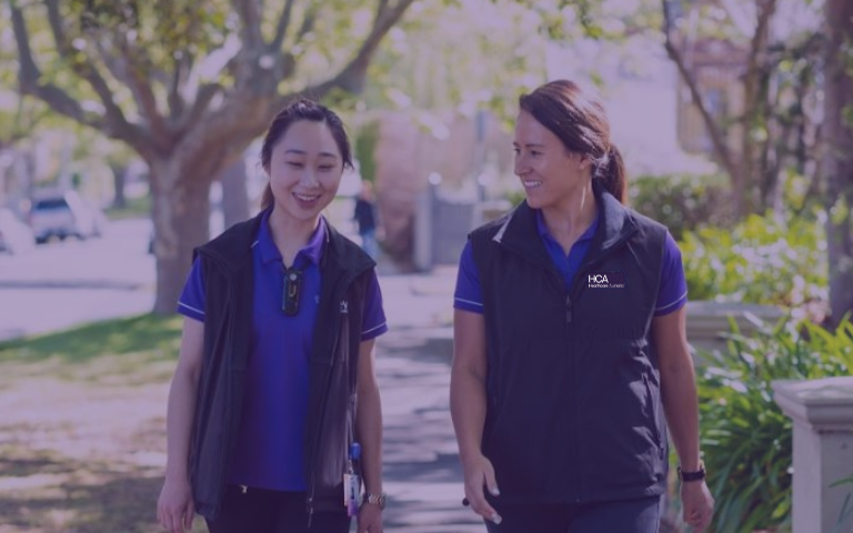 Two HCA Allied Health Employees in conversation
