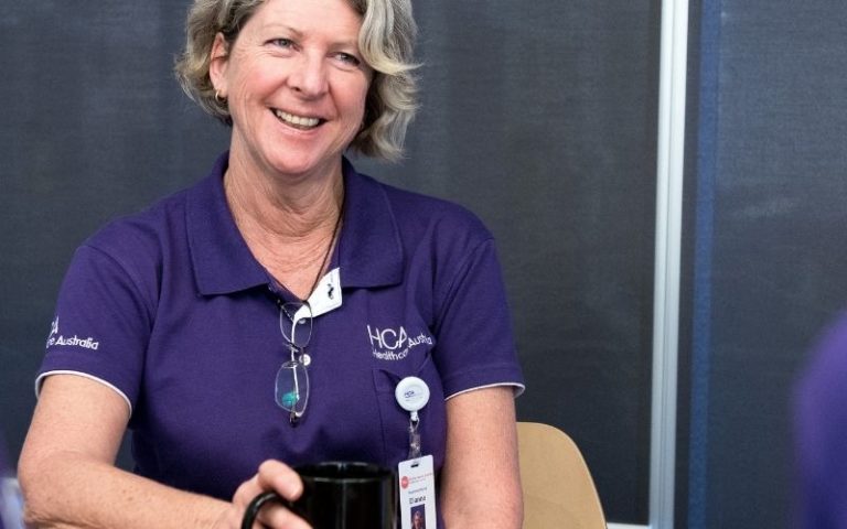 HCA Nurse laughing with colleagues